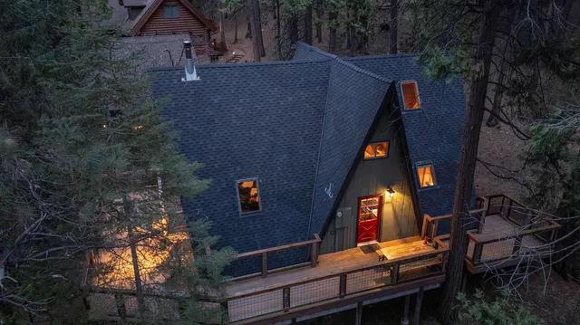 an aerial view of a house with a yard