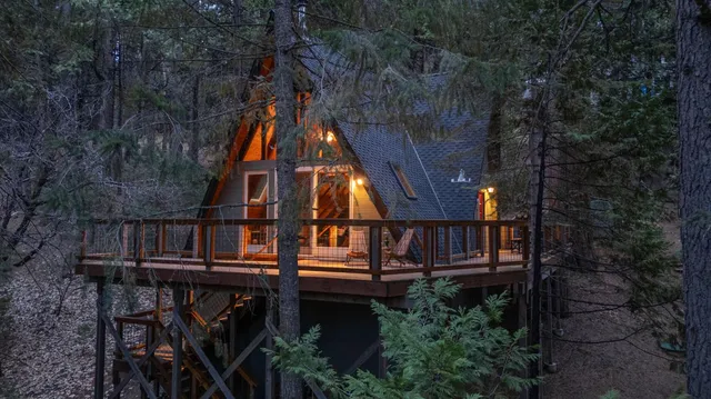 a view of a lush green hillside and a mountain view