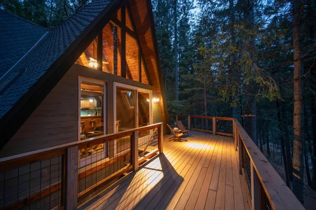 a view of balcony with wooden floor and outdoor seating