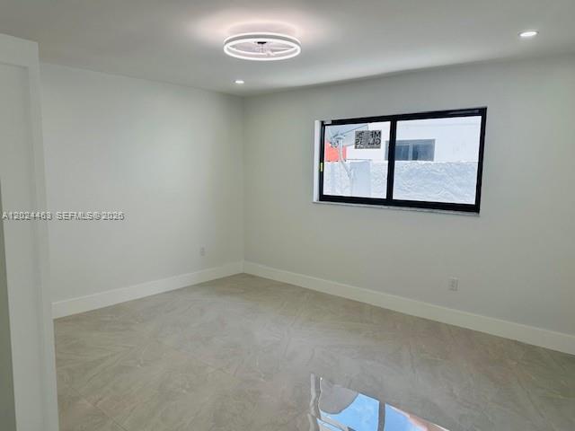 11870 Southwest 5th Street, Unit 1 Miami, FL 33184 - Photo 30 of 38 an empty room with wall painting and a window