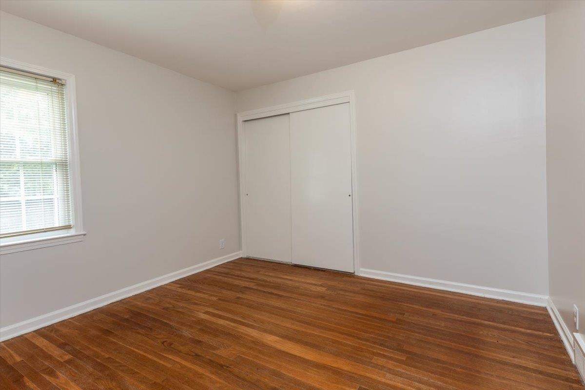 670 Peterson Lake Road Collierville, TN 38017 - Photo 20 of 37 Bright interior space featuring wood-finish flooring, white baseboards, and a window with venetian blinds