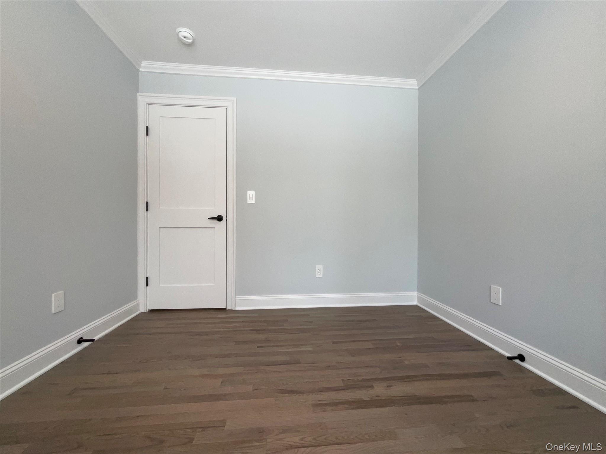 89 B Mount Sinai-Coram Road Coram, NY 11727 - Photo 20 of 23 a view of an empty room with wooden floor