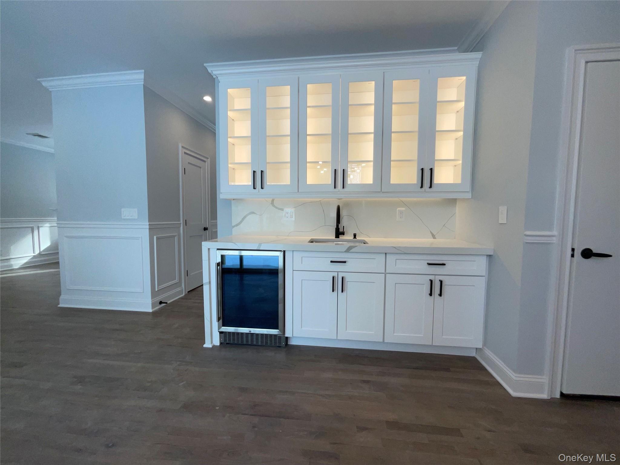 89 B Mount Sinai-Coram Road Coram, NY 11727 - Photo 10 of 23 a kitchen with a sink cabinets and a window