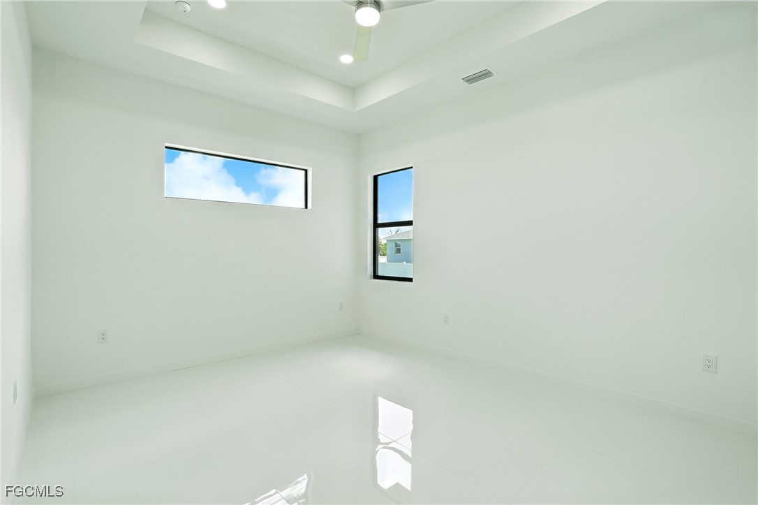 2725 Embers Parkway West Cape Coral, FL 33993 - Photo 14 of 32 an empty room with windows