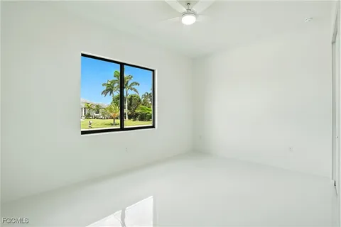 an empty room with a fan