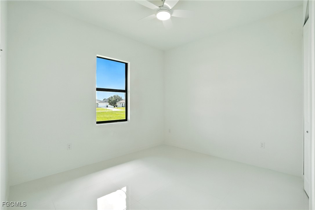 2725 Embers Parkway West Cape Coral, FL 33993 - Photo 22 of 32 an empty room with a window