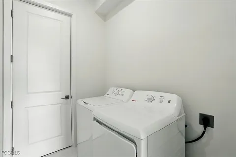 a view of empty room with white walls