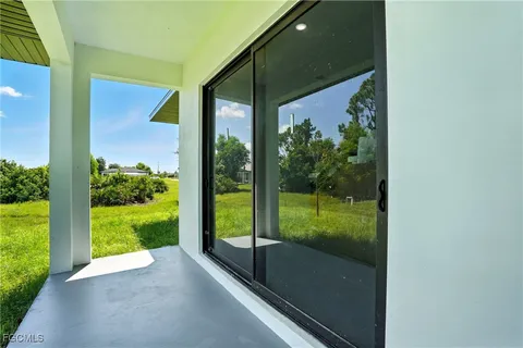 a house view with swimming pool in front of it