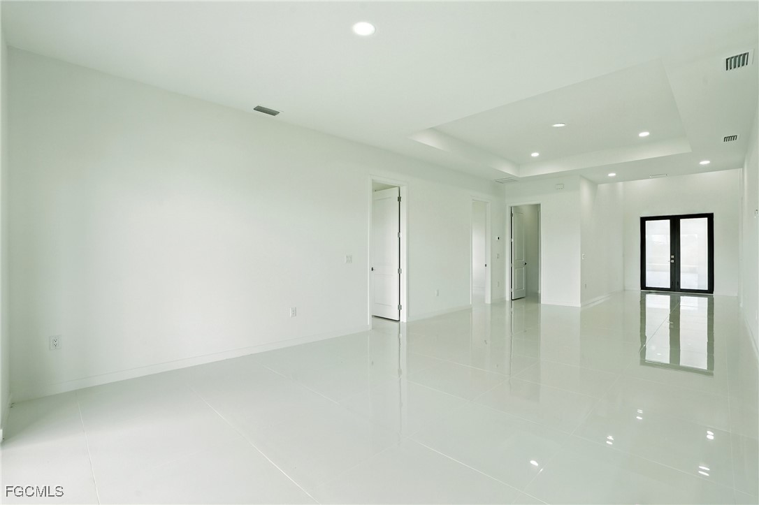 2725 Embers Parkway West Cape Coral, FL 33993 - Photo 8 of 32 an empty room with window and cabinet