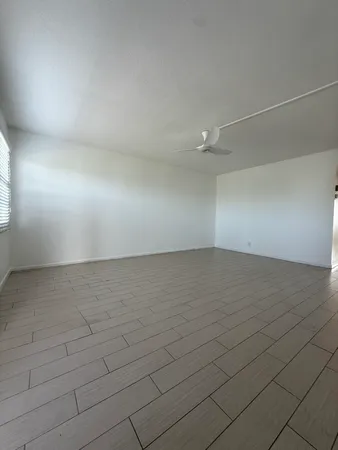 a view of a kitchen with a sink and a stove top oven