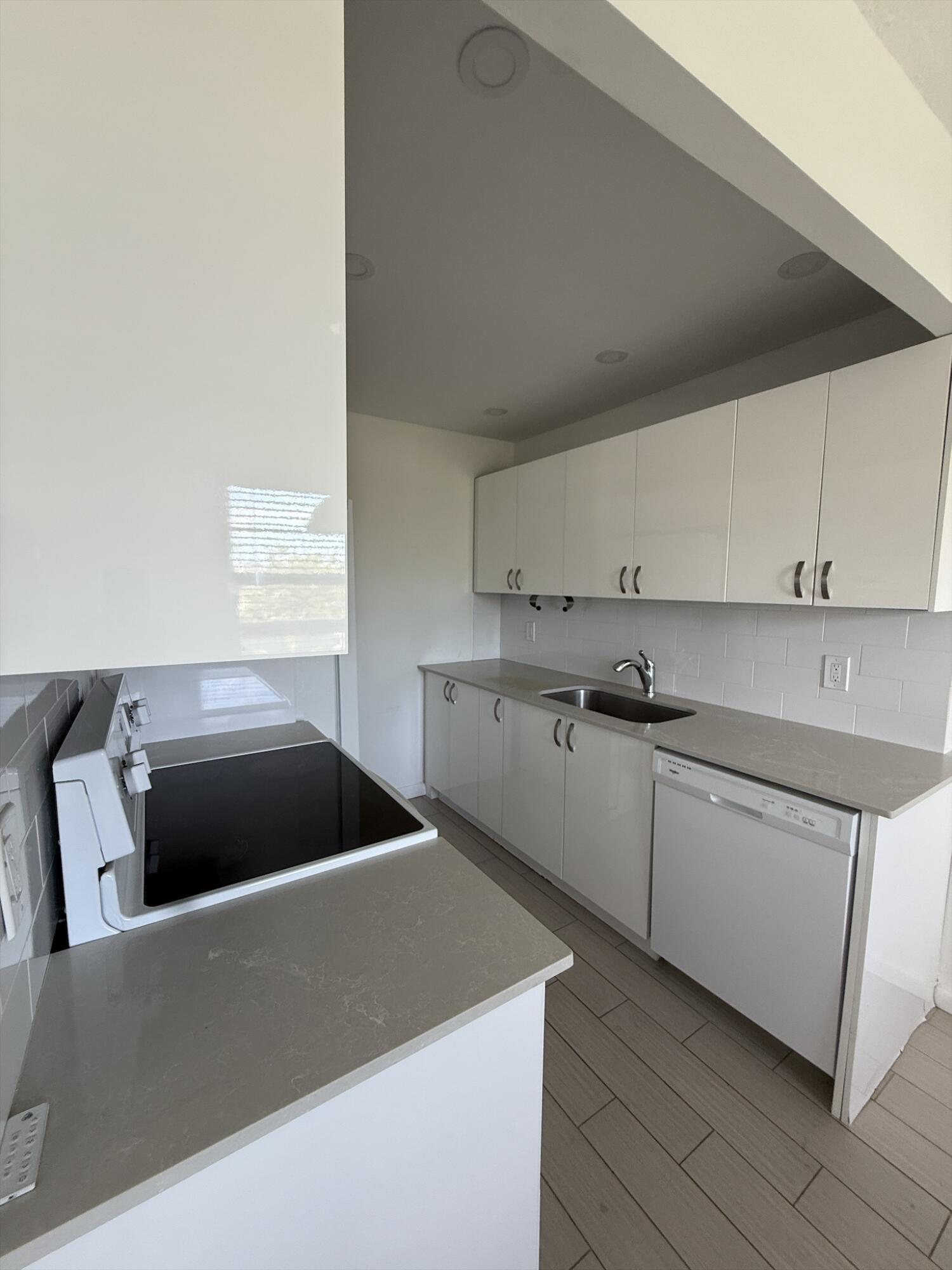 4085 Cornwall East Boca Raton, FL 33434 - Photo 6 of 15 a kitchen with a cabinets and white appliances