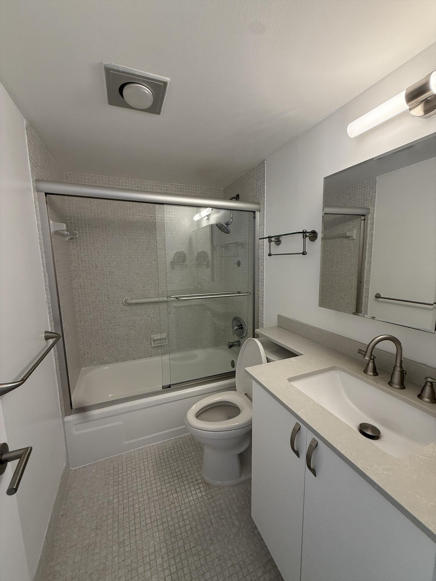 4085 Cornwall East Boca Raton, FL 33434 - Photo 9 of 15 a bathroom with a sink a toilet and shower