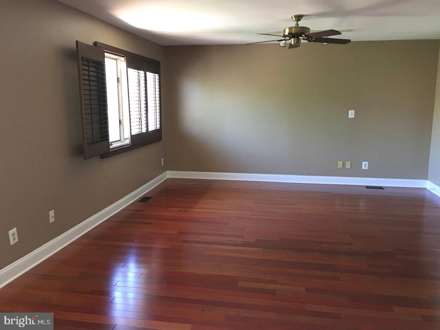 19 Hanover Court Princeton, NJ 08540 - Photo 12 of 25 wooden floor in an empty room with a window