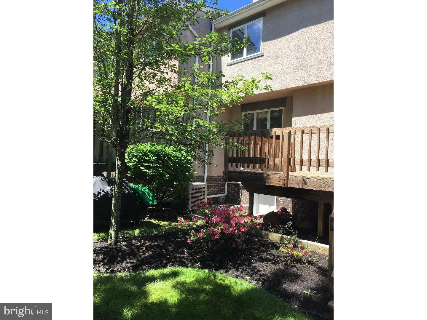 19 Hanover Court Princeton, NJ 08540 - Photo 25 of 25 a view of a house with a small yard and floor to ceiling window