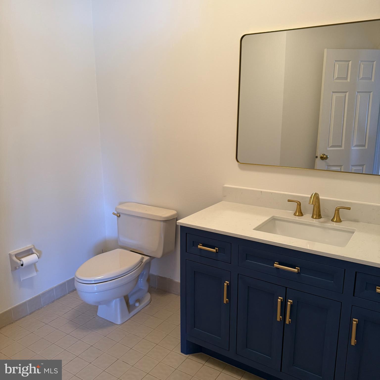19 Hanover Court Princeton, NJ 08540 - Photo 8 of 25 a bathroom with a granite countertop toilet sink and mirror
