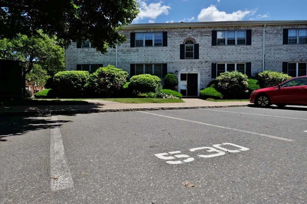 157 Lake Shore Road, Unit 2 Boston, MA 02135 - Photo 1 of 28 a front view of house with yard