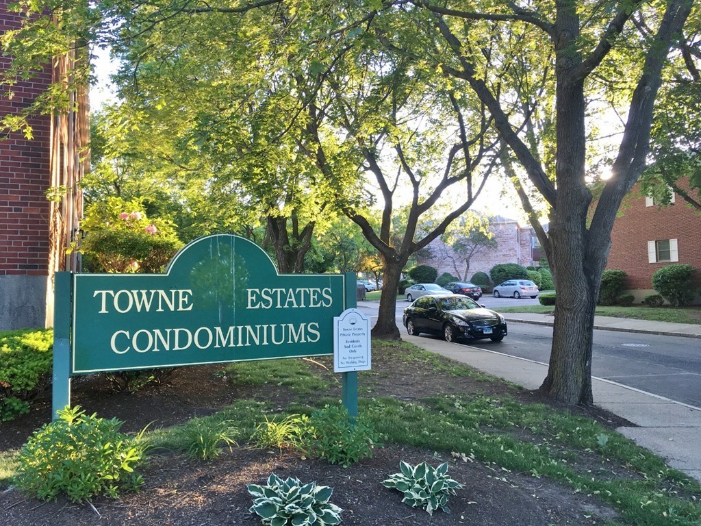 157 Lake Shore Road, Unit 2 Boston, MA 02135 - Photo 13 of 28 a view of a street sign under a large tree