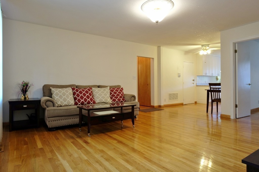 157 Lake Shore Road, Unit 2 Boston, MA 02135 - Photo 18 of 28 a living room with furniture and a table