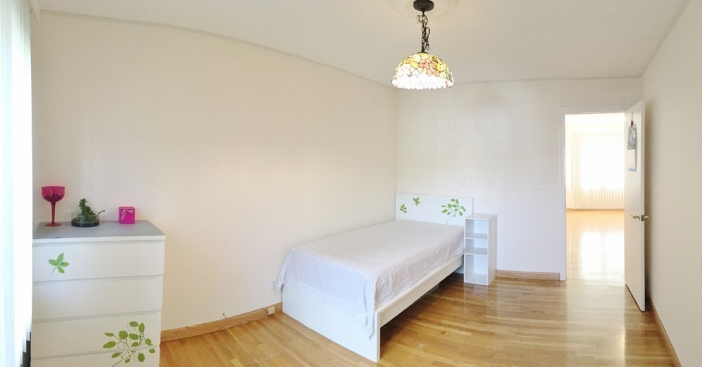 157 Lake Shore Road, Unit 2 Boston, MA 02135 - Photo 28 of 28 a bed room with a bed and a window