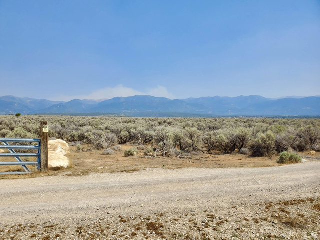 Undisclosed Address Spring City, UT 84662 - Photo 8 of 19 Expansive terrain featuring a gravel road, natural brush, and a metal gate