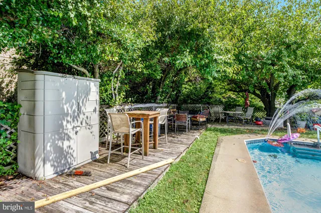 a view of a backyard with sitting area