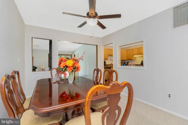 a dining room with furniture and window