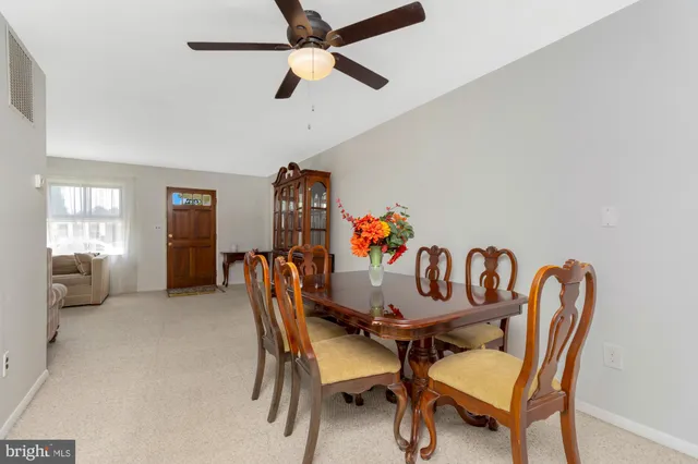 a kitchen with stainless steel appliances granite countertop a refrigerator sink and cabinets