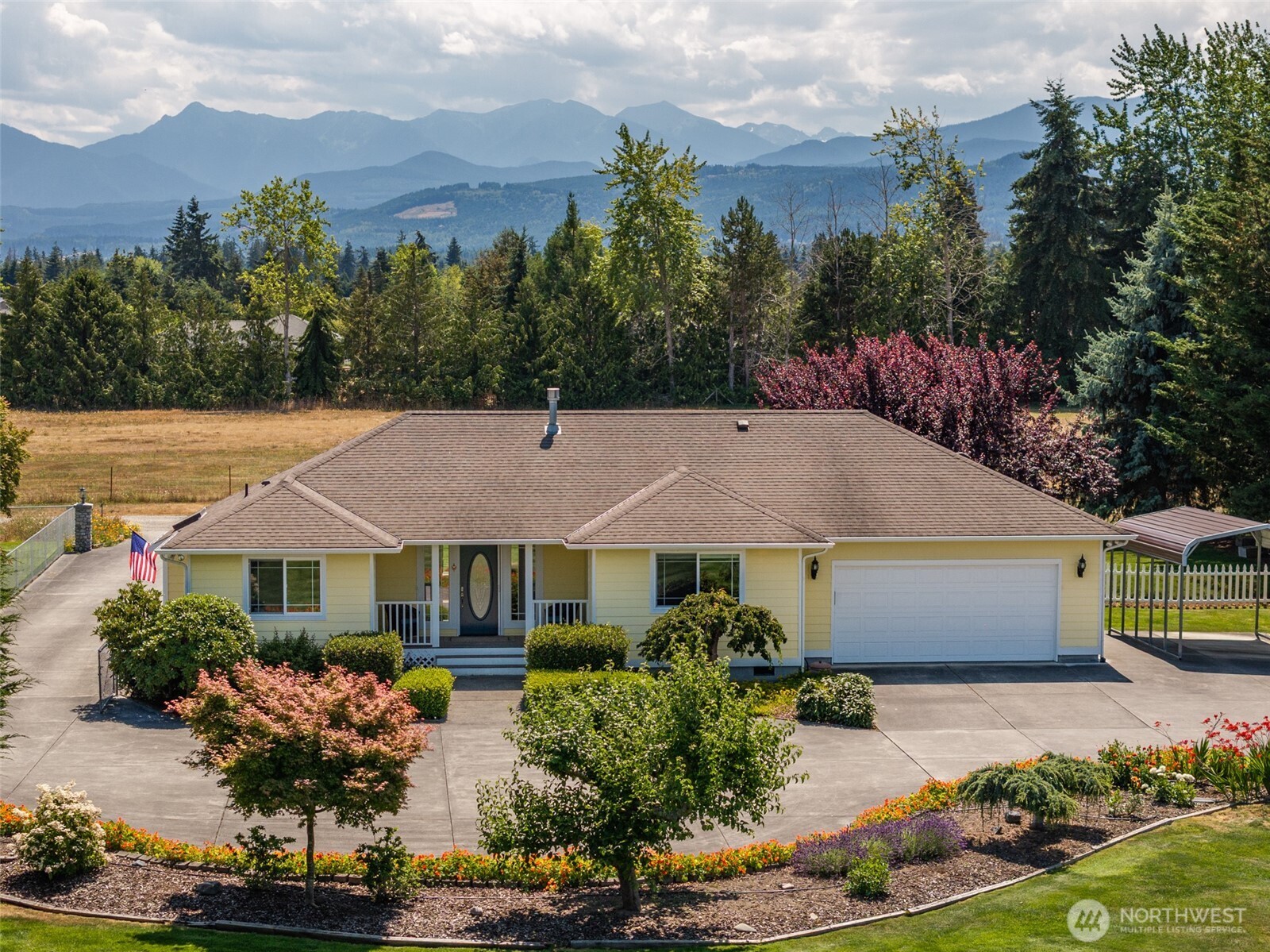 170 Donaper Road Sequim, WA 98382 - Photo 1 of 40 a front view of house with yard and trees