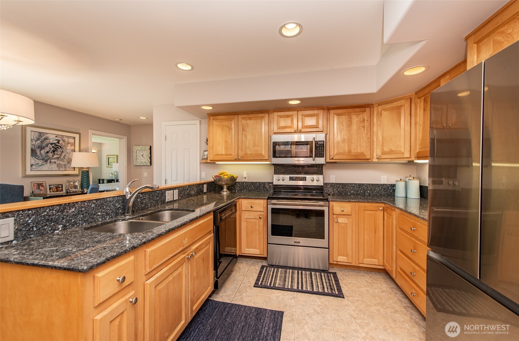 170 Donaper Road Sequim, WA 98382 - Photo 13 of 40 a kitchen with stainless steel appliances granite countertop a sink stove and refrigerator