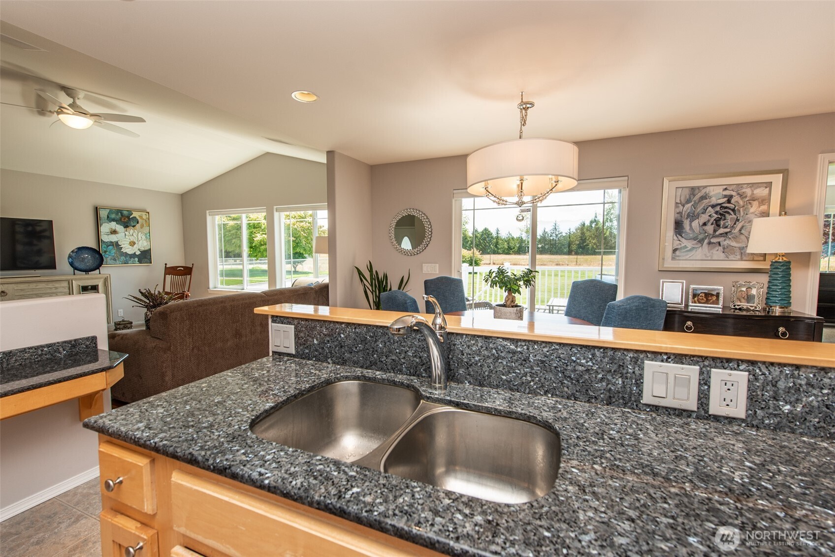 170 Donaper Road Sequim, WA 98382 - Photo 14 of 40 a kitchen with granite countertop a sink and a granite counter tops