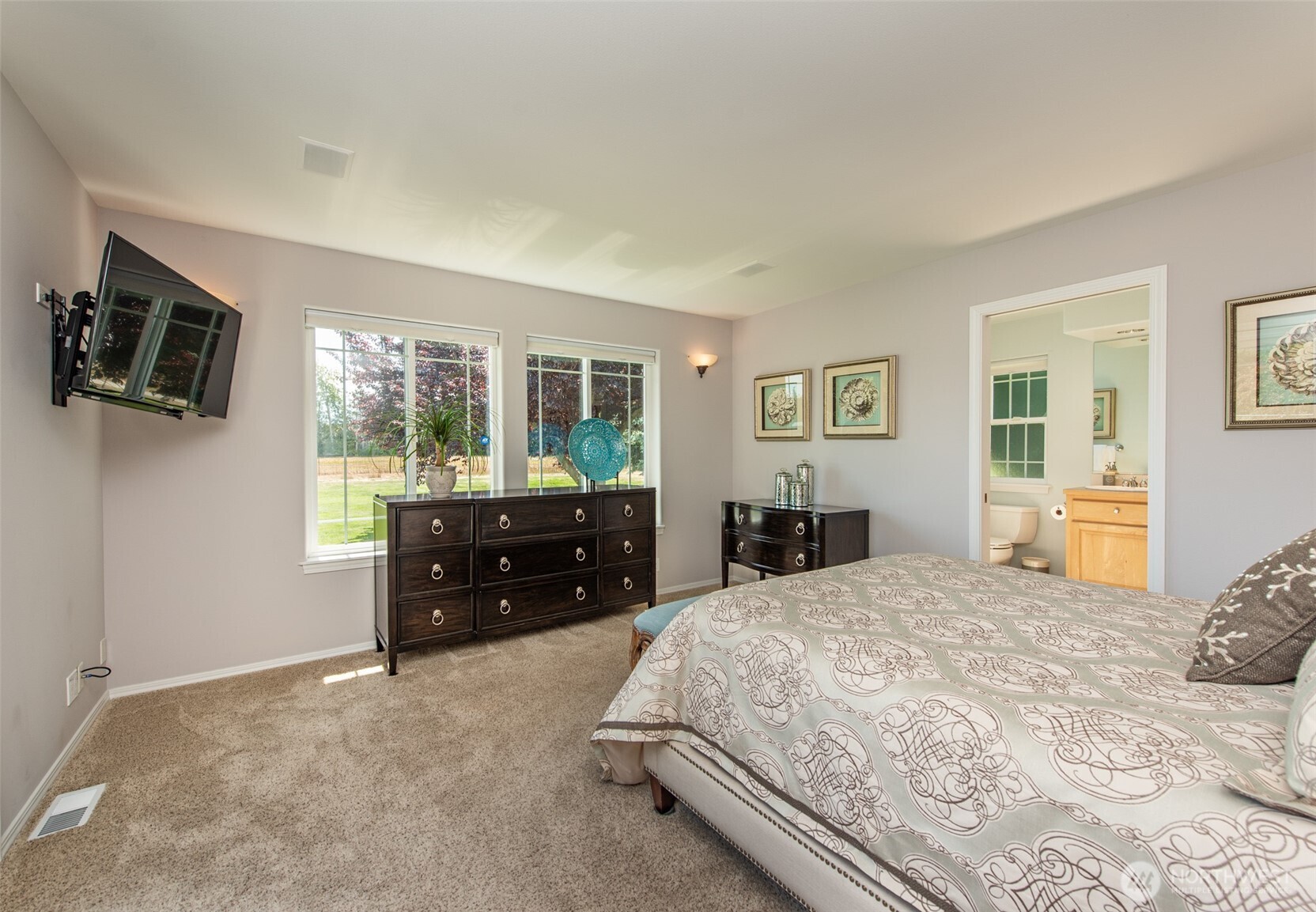 170 Donaper Road Sequim, WA 98382 - Photo 17 of 40 a living room with a couch and a flat screen tv