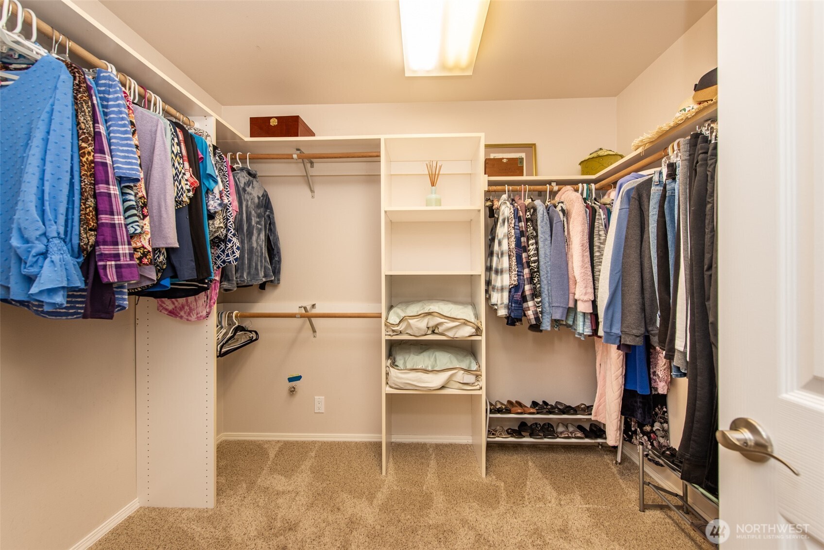 170 Donaper Road Sequim, WA 98382 - Photo 21 of 40 a view of walk in closet with clothes and shoes