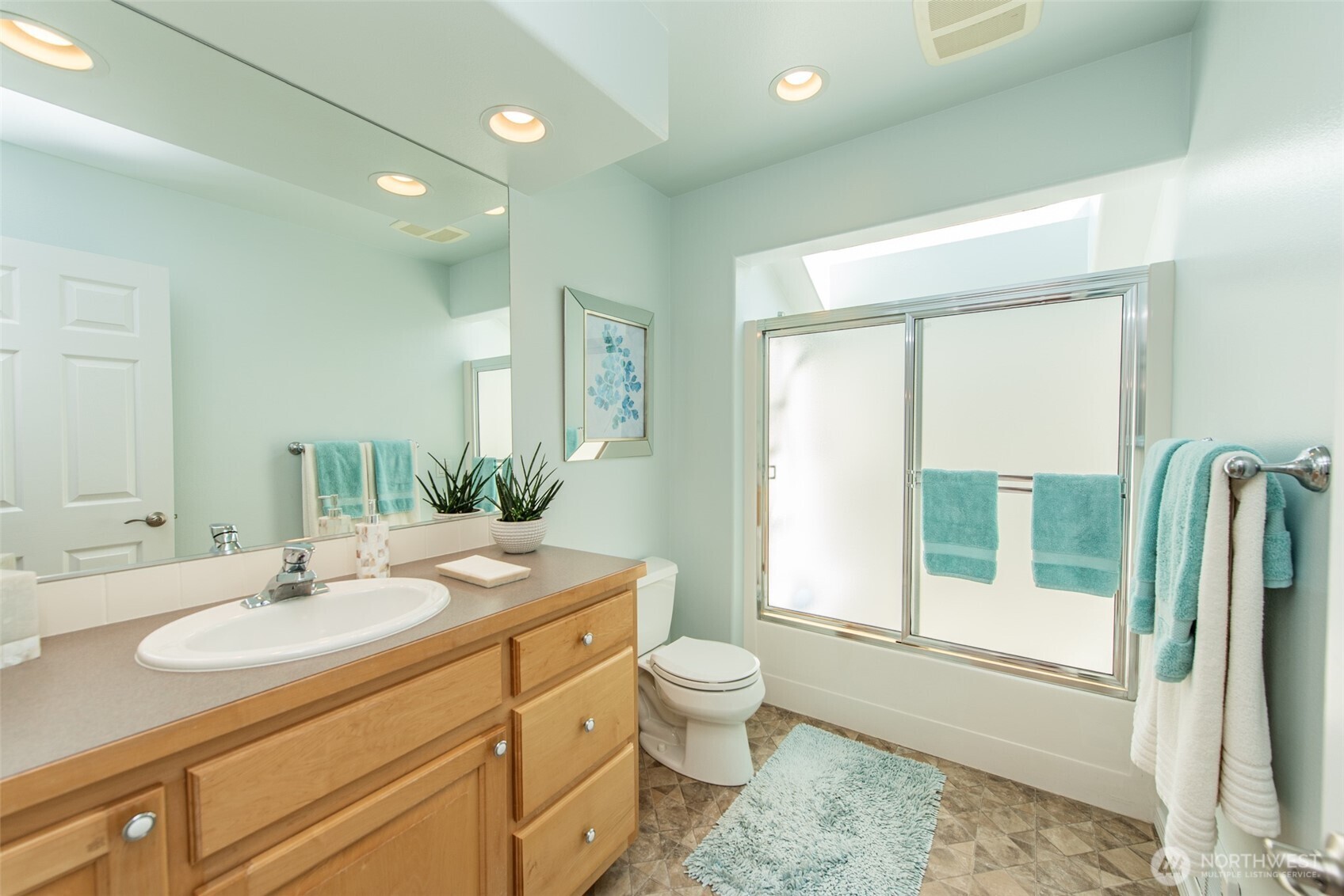 170 Donaper Road Sequim, WA 98382 - Photo 24 of 40 a bathroom with a granite countertop sink toilet and shower