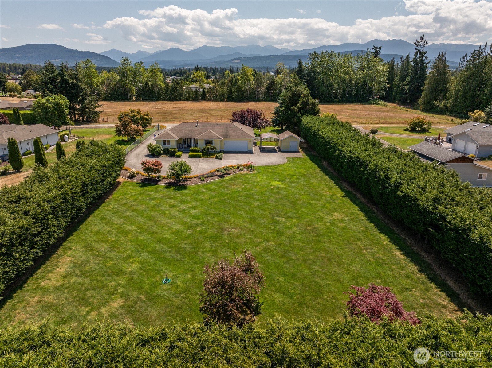 170 Donaper Road Sequim, WA 98382 - Photo 3 of 40 a view of a garden with houses