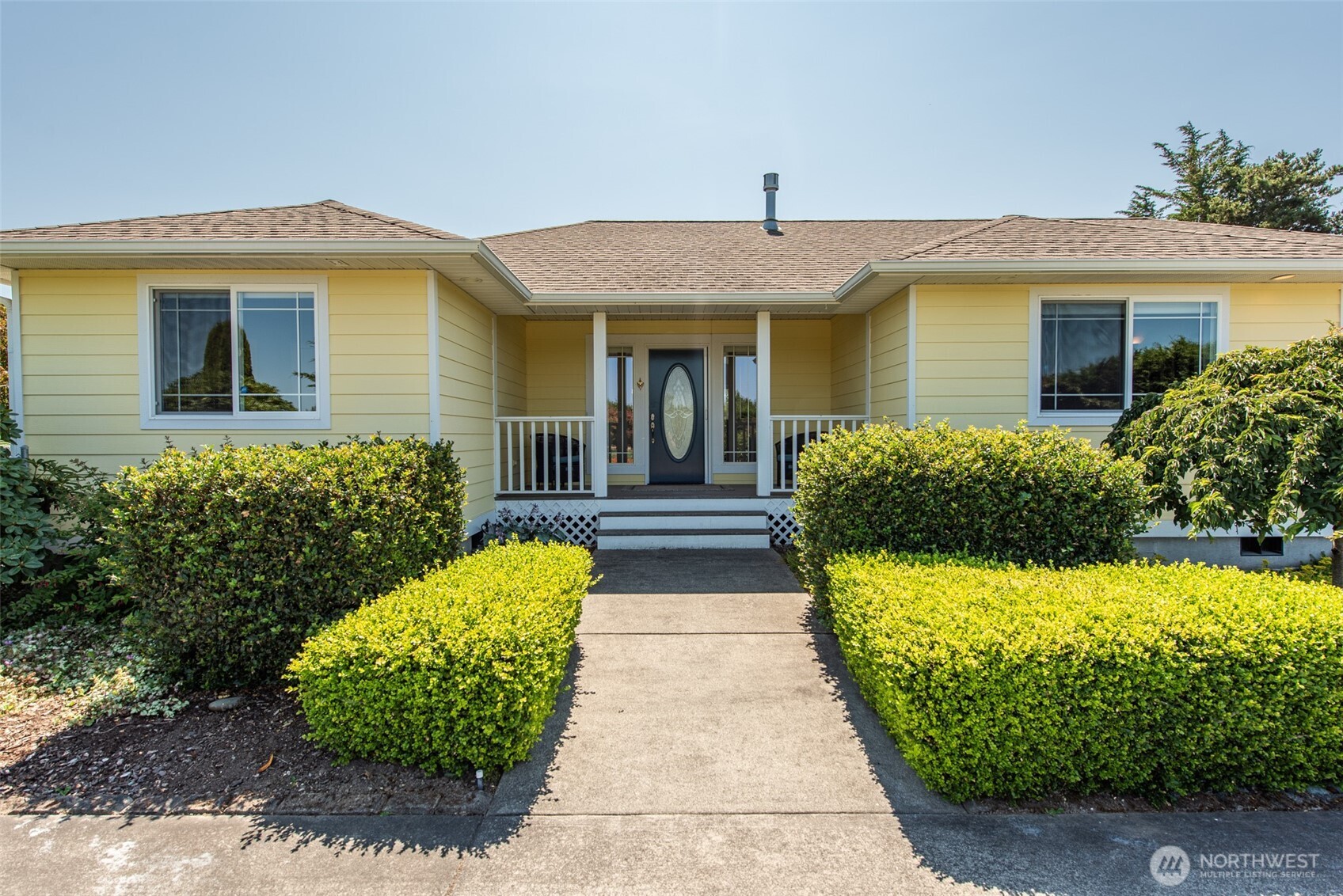 170 Donaper Road Sequim, WA 98382 - Photo 5 of 40 a front view of a house with a yard and potted plants