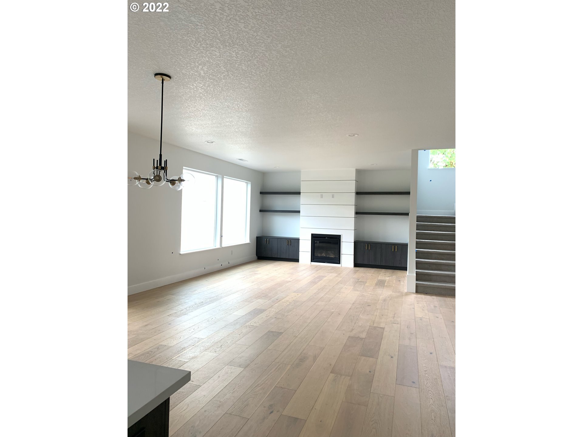 1829 North 4th Way Ridgefield, WA 98642 - Photo 3 of 17 a view of empty room with a fireplace and cabinet