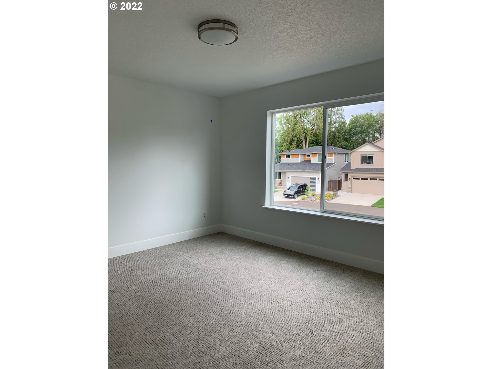 1829 North 4th Way Ridgefield, WA 98642 - Photo 9 of 17 a view of an empty room with a window