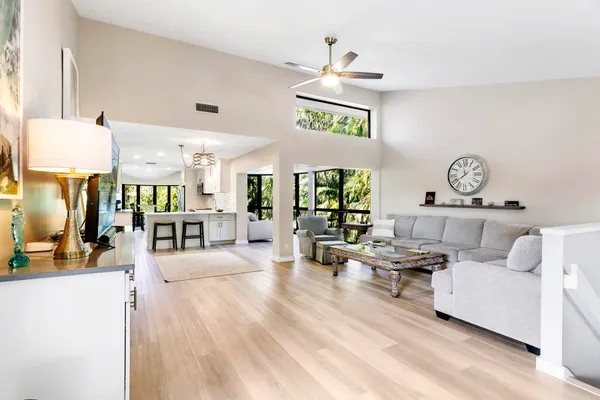 a living room with furniture and a large window