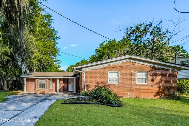front view of a house with a yard