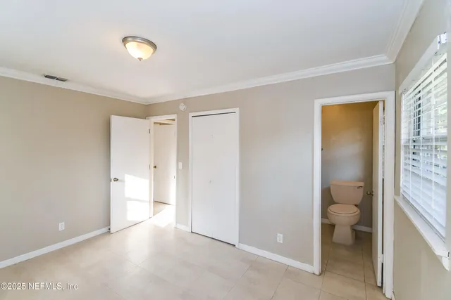 a view of a bathroom with a toilet and a shower