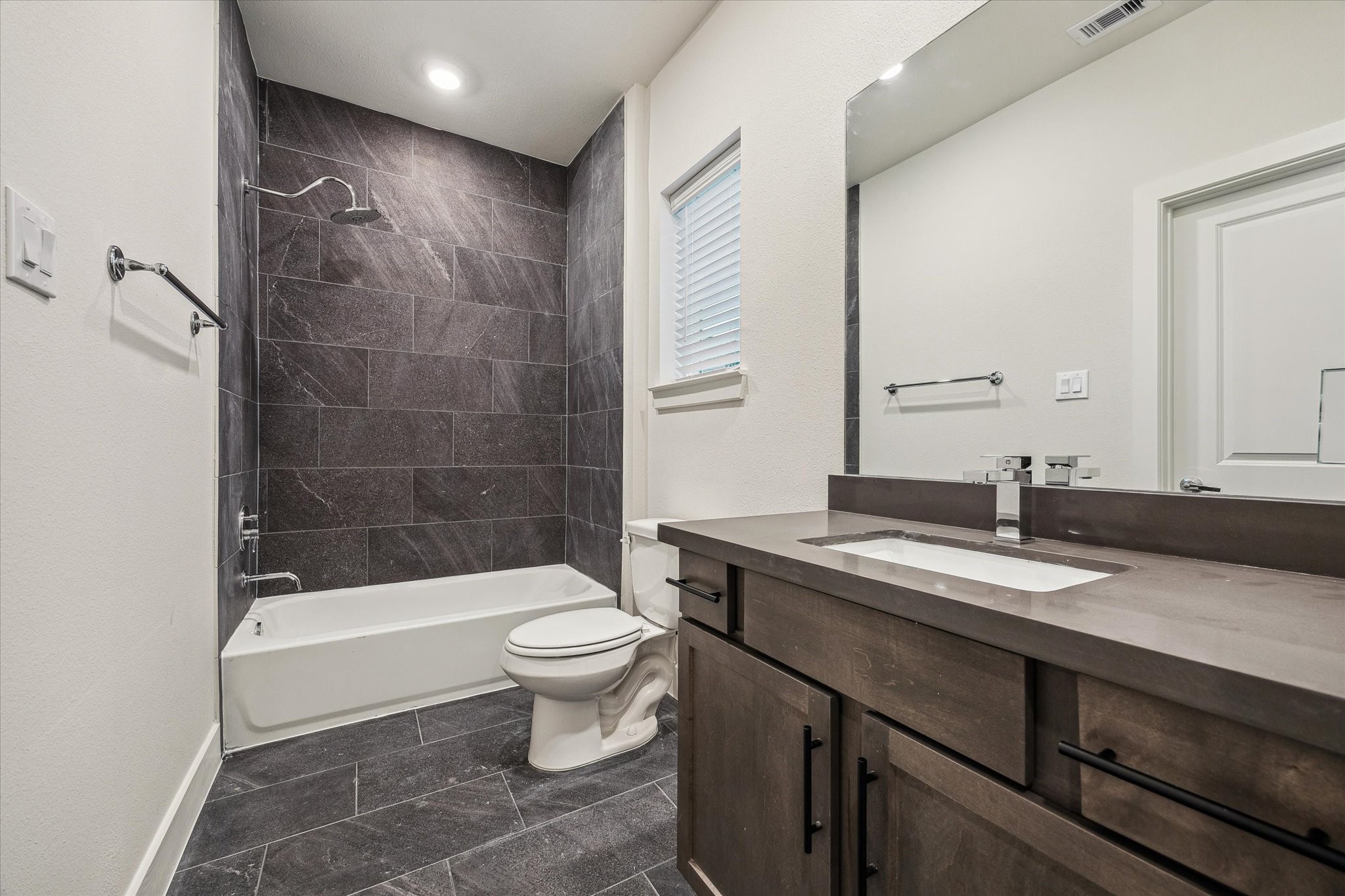 6441 Rena Street Houston, TX 77092 - Photo 11 of 11 a bathroom with a sink a toilet and shower