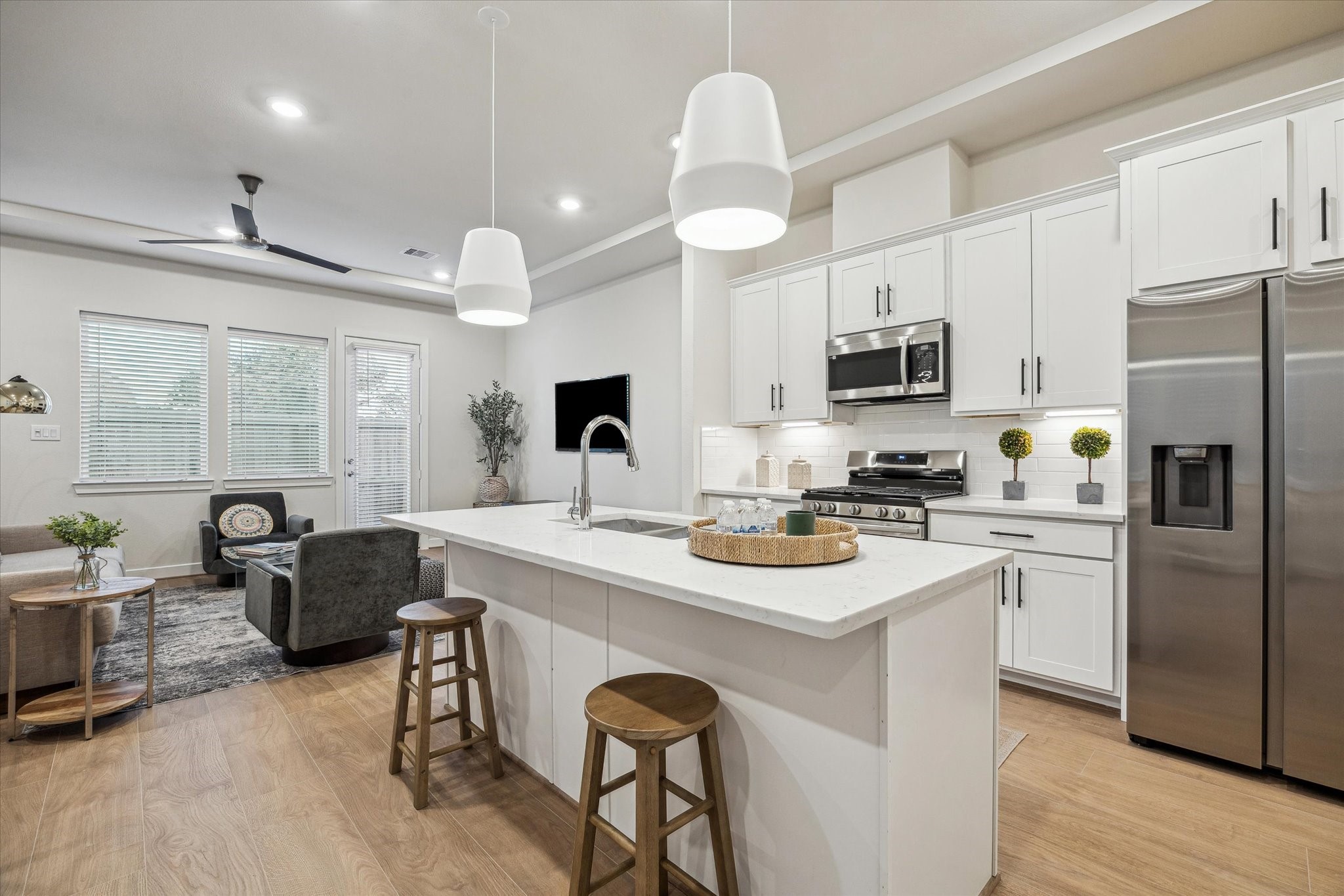 6441 Rena Street Houston, TX 77092 - Photo 2 of 11 a kitchen with kitchen island granite countertop a sink cabinets and stainless steel appliances