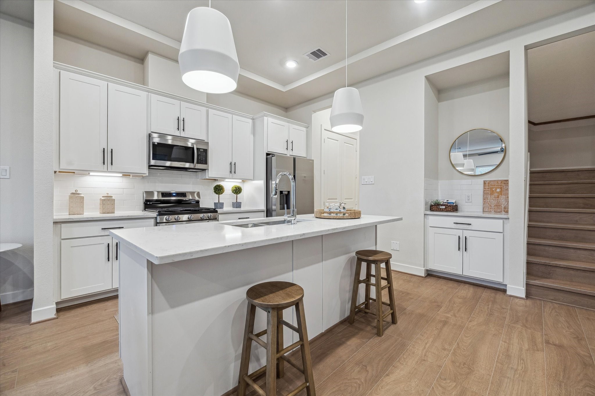 6441 Rena Street Houston, TX 77092 - Photo 3 of 11 a kitchen with cabinets a sink and appliances