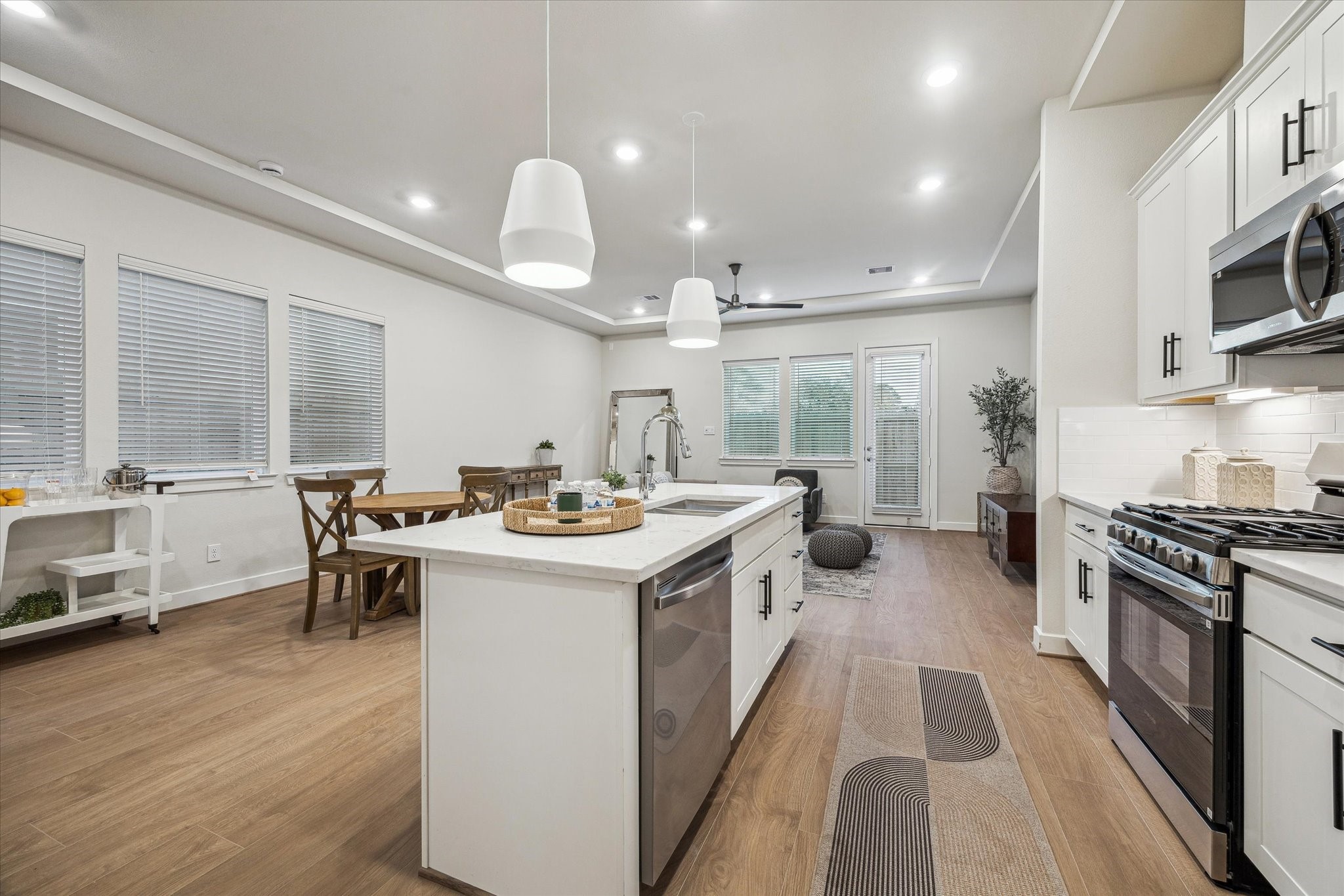 6441 Rena Street Houston, TX 77092 - Photo 4 of 11 a kitchen with counter top space a sink appliances and cabinets