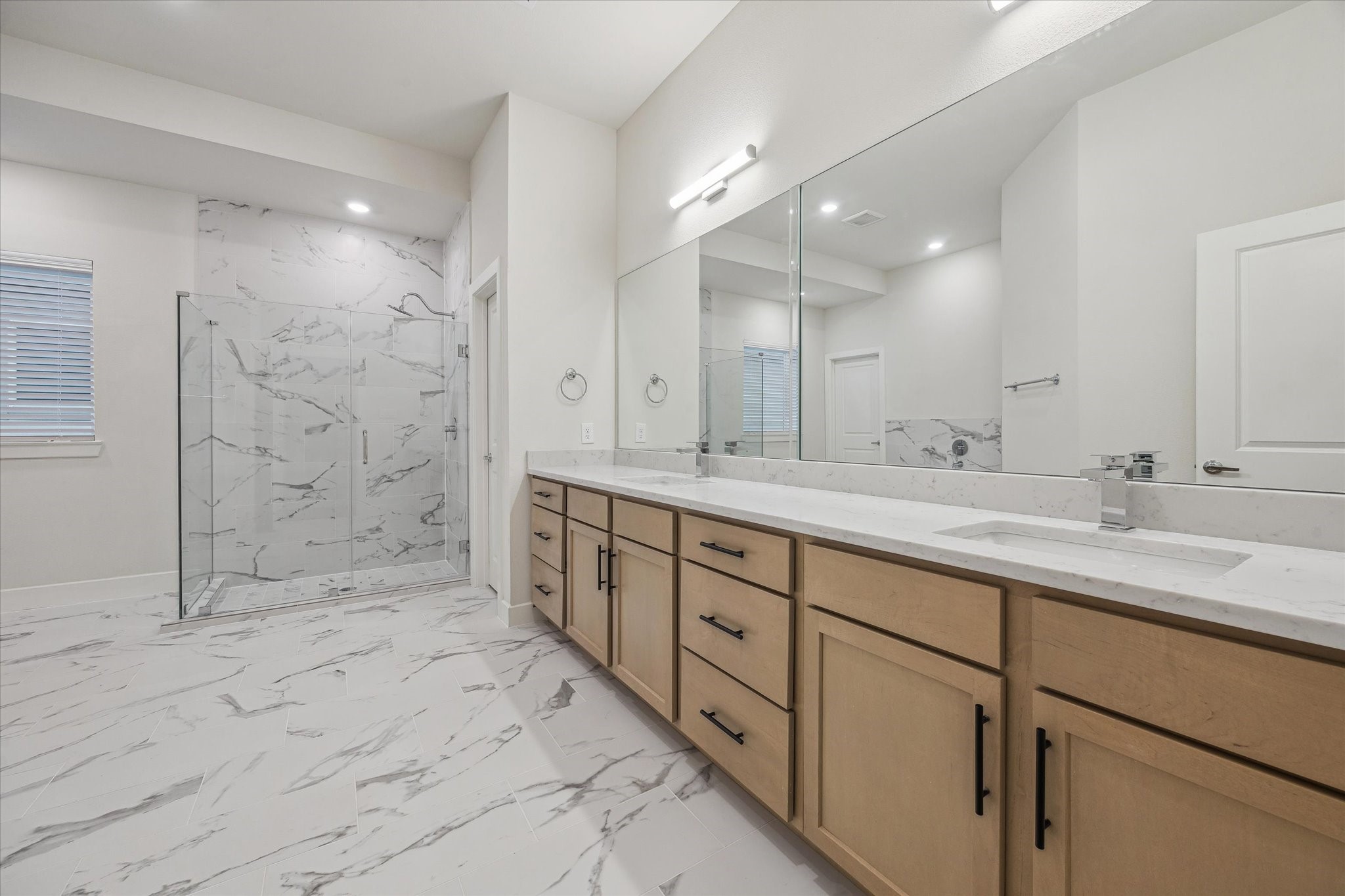 6441 Rena Street Houston, TX 77092 - Photo 7 of 11 a bathroom with double sink and a shower