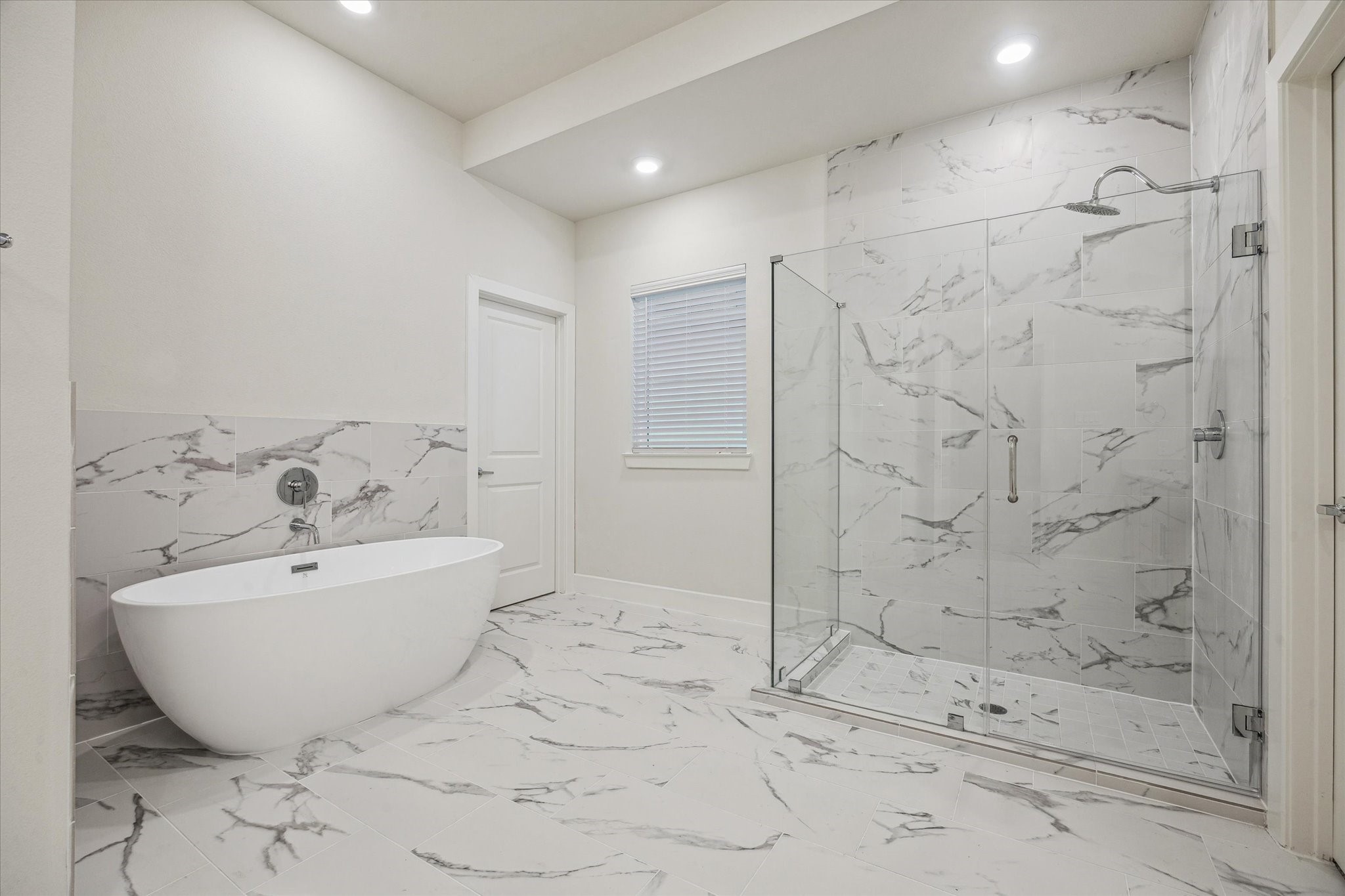 6441 Rena Street Houston, TX 77092 - Photo 8 of 11 a bathroom with a bathtub and shower