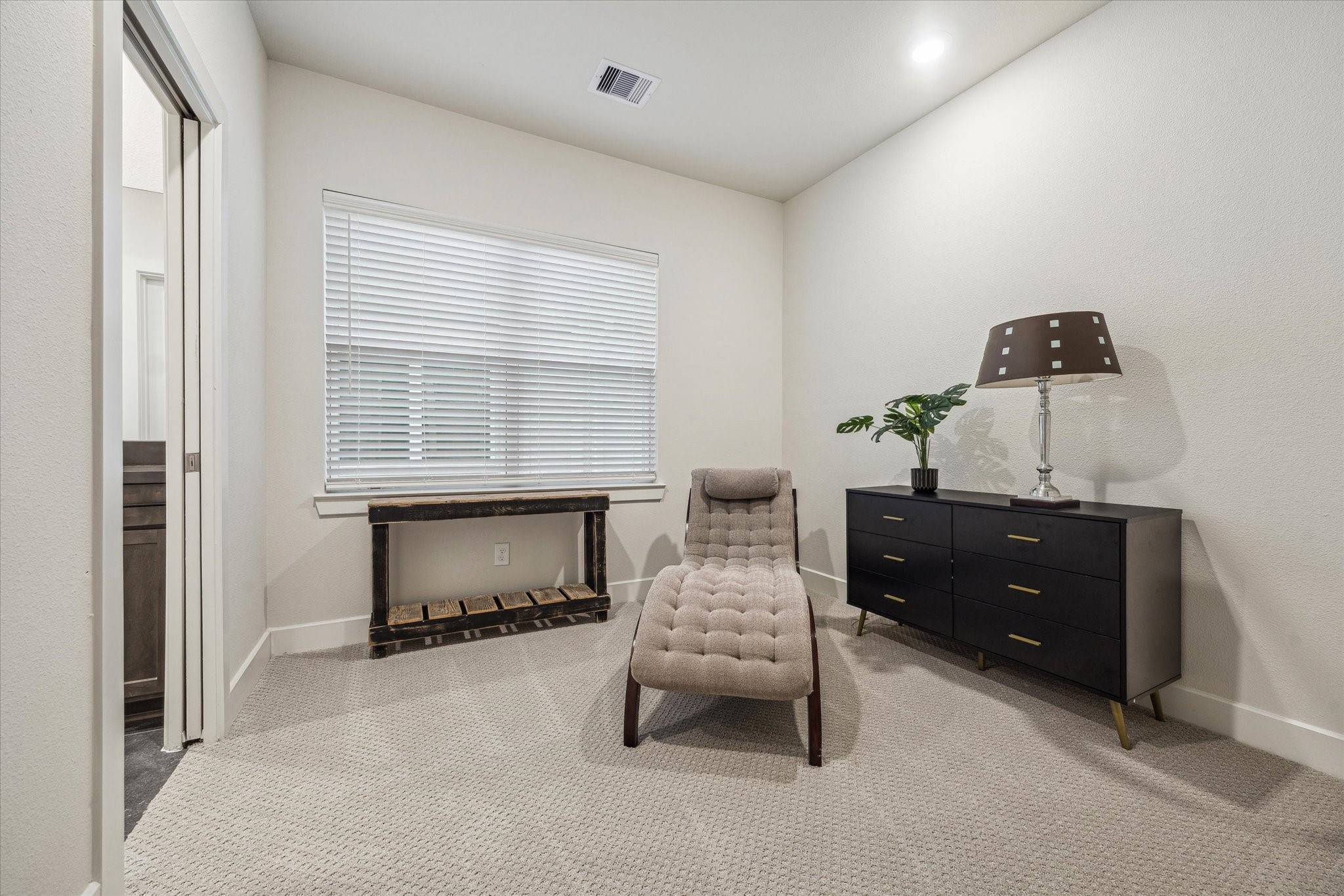 6441 Rena Street Houston, TX 77092 - Photo 10 of 11 a bedroom with a bed and a window