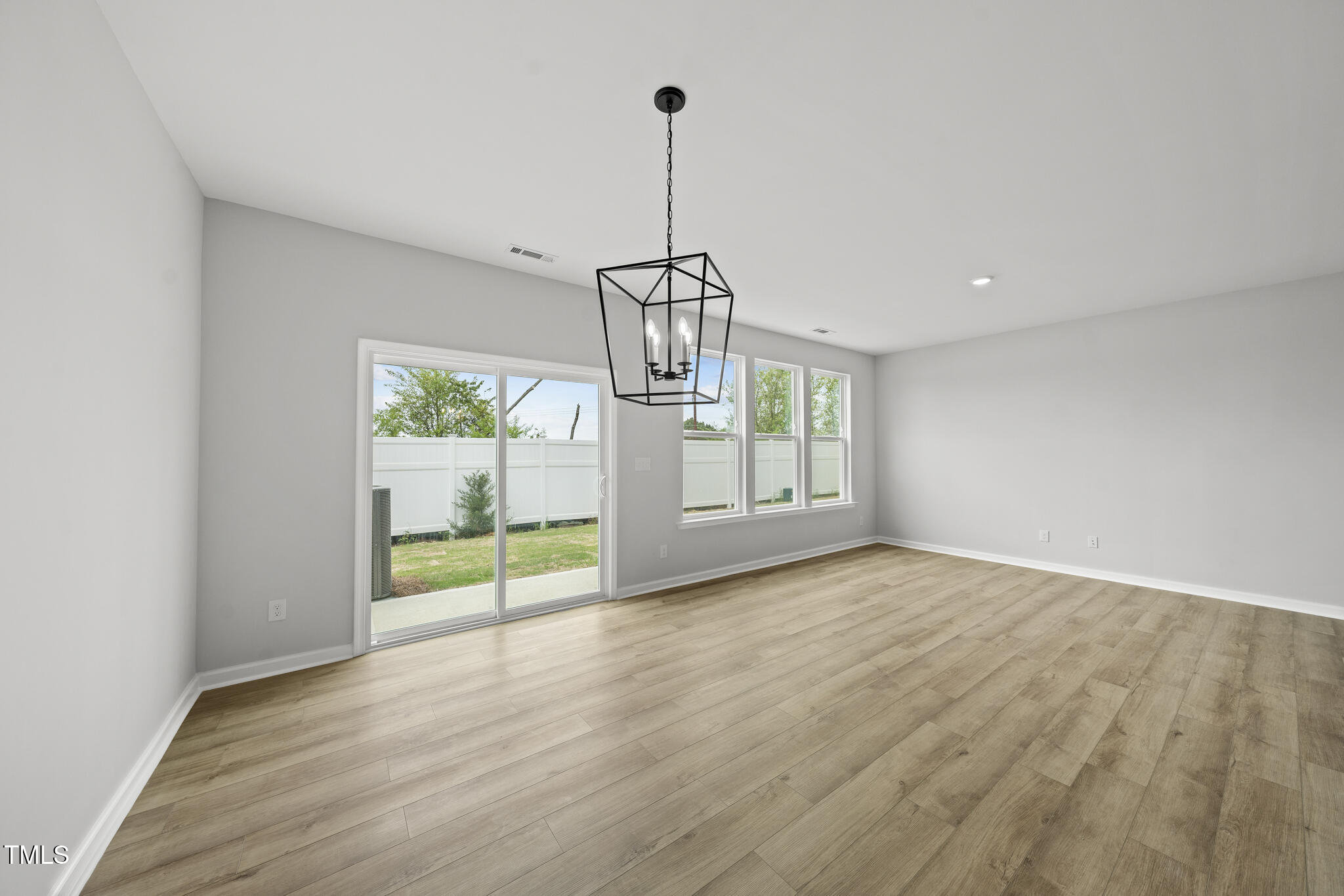 104 Ripple Way, Unit 318 Clayton, NC 27520 - Photo 8 of 42 Dining area with sliders to sun patio