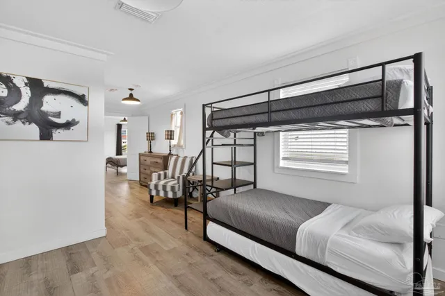 a bedroom with furniture and a window