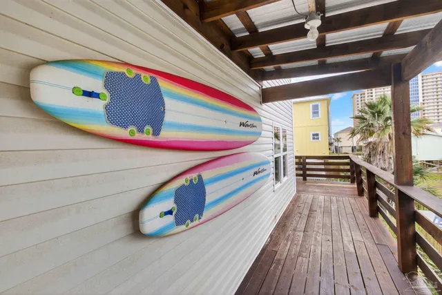 a view of an outdoor space with wooden floor